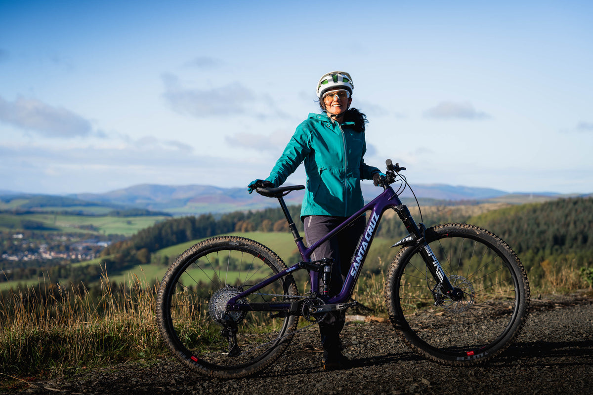 Aneela and her new bike at Glentress Forest